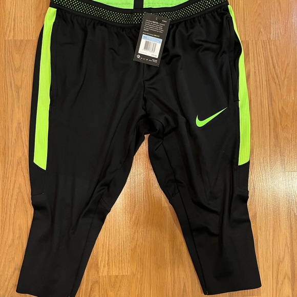 Nike Dri-Fit Men’s knee length legging/black w neon green/zippered side pockets. - Picture 2 of 3
